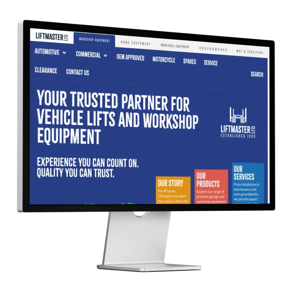 Computer monitor displaying the Liftmaster website homepage, featuring the heading Your trusted partner for vehicle lifts and workshop equipment and navigation menus for automotive, commercial, OEM approved, and other categories.